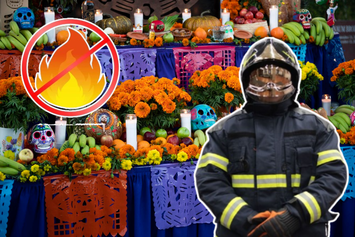 Bombero de CDMX frente a una ofrenda de Día de Muertos.    Foto: Especial