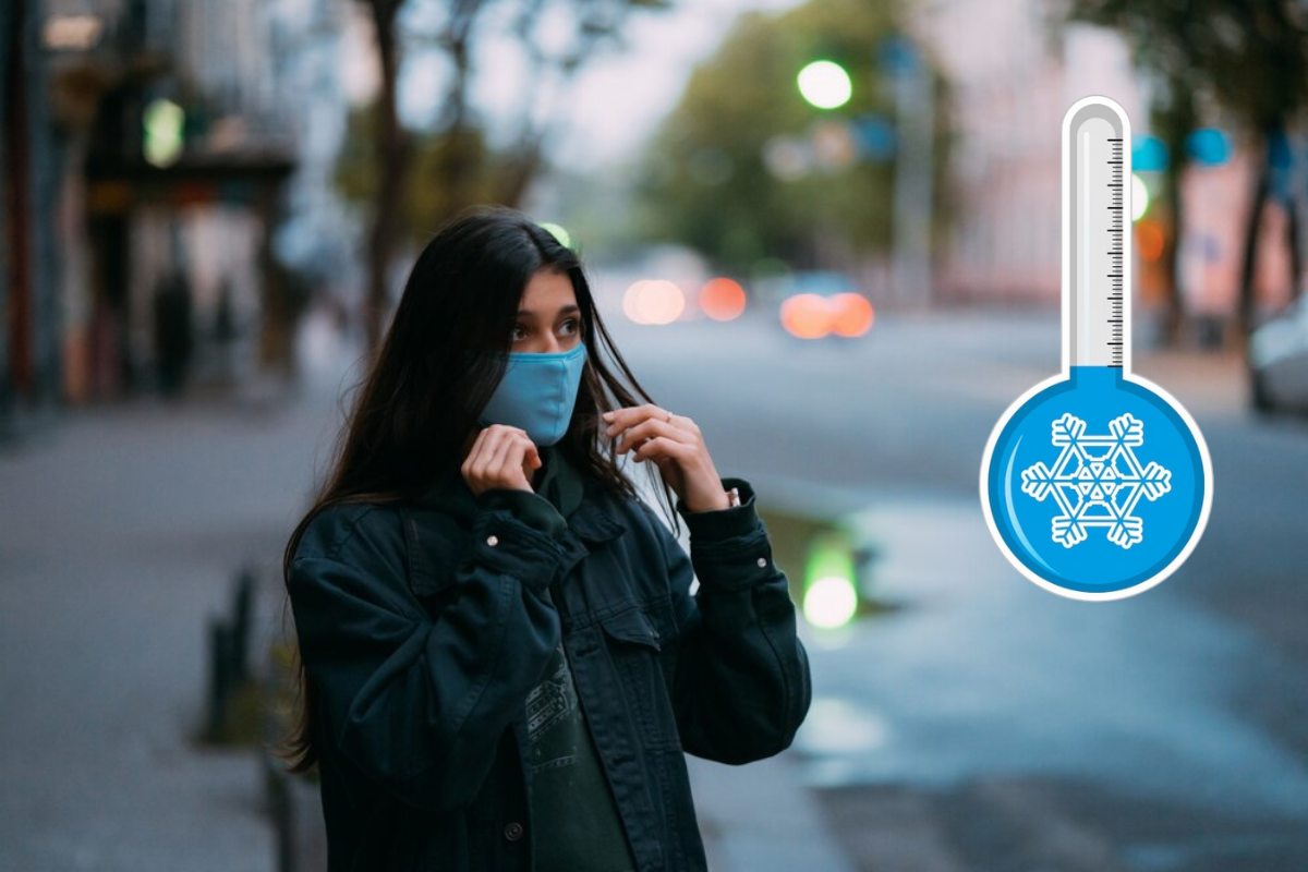 Mujer abrigada debido al frío y usando un cubrebocas, con una ilustración de termómetro en la esquina superior derecha.    Foto: Freepik, editada en Canva.